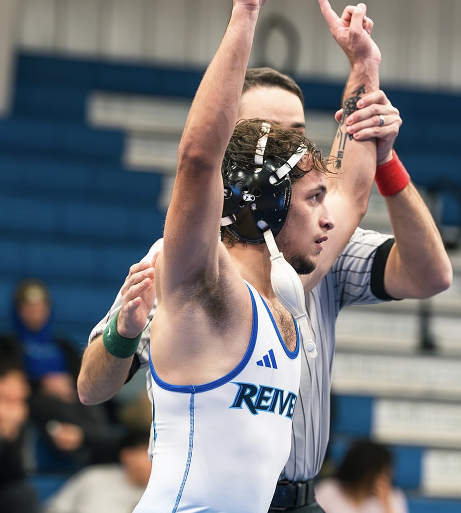 Noah Jones celebrating a wrestling victory for Iowa Western